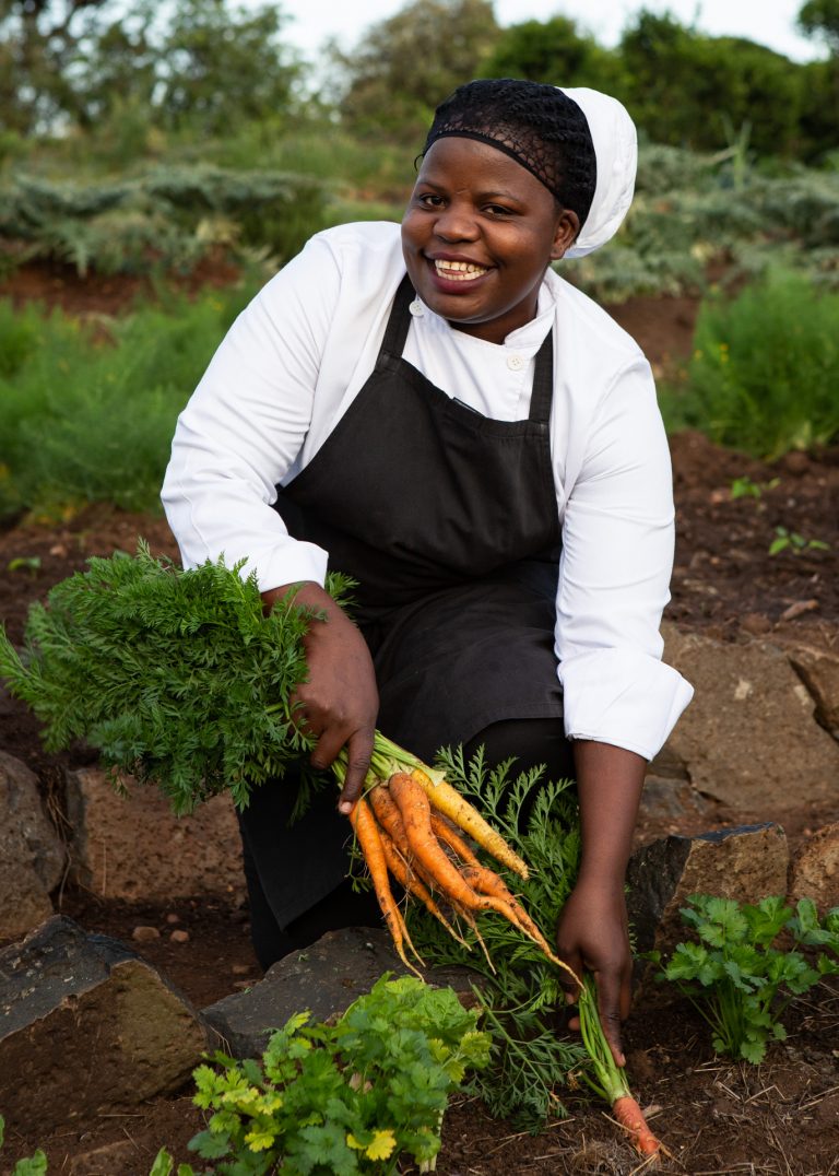 Chef Brenda fetching ingredients from Angama Mara Shamba