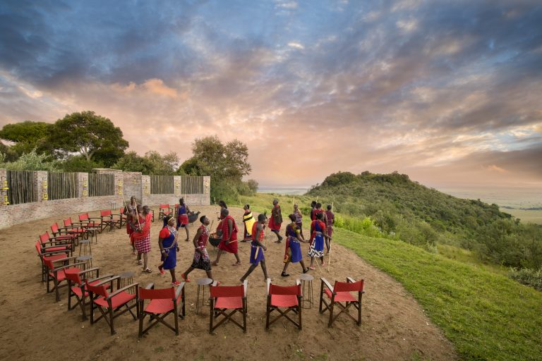Maasai warriors dancing at Angama Mara sunset boma