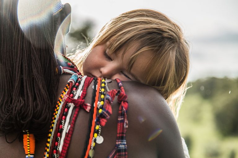 Child with Maasai Warrior in the Maasai Mara
